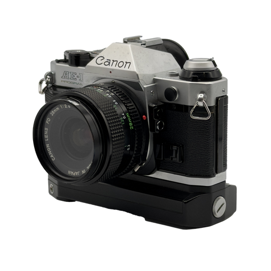 Canon AE-1 Program 35mm Film Camera with Canon FD 28mm f/2.8 Film Lens, Canon 50mm f/1.8 FD Film Lens, and Canon FD 100-200mm f/5.6 Film Lens